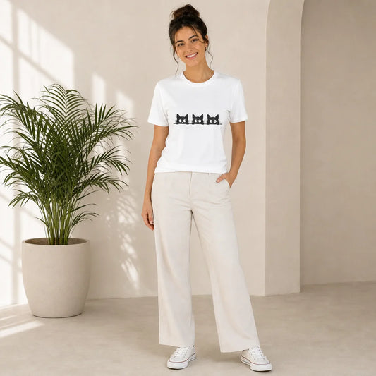 Three Black Cats Peeking White Tee — model wearing the printed tee